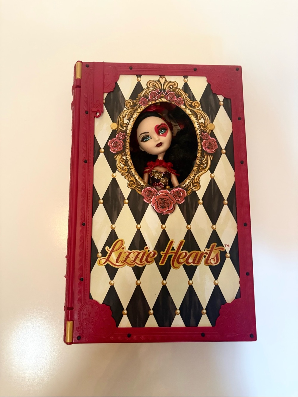 Collector Ever After High Lizzie Hearts Doll in Red Plastic Book Display Case